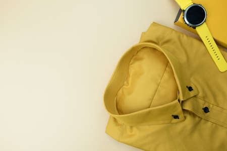Set of yellow accessories outfits for men on yellow background. Trendy fashion male flat lay backgroundの写真素材