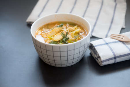 Homemade suki with pork and fresh mixed vegetables in white bowl