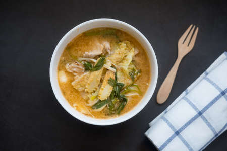 Suki in broth with pork and fresh mixed vegetables, homemade sukiの写真素材