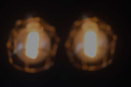 Blur background of lighting lamp is hanging at ceiling
