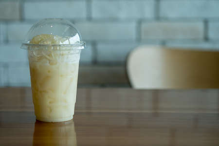 Fresh pomelo juice with slice pomelo on top in plastic glassの写真素材