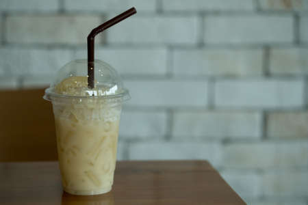 Fresh pomelo juice with slice pomelo on top in plastic glassの写真素材