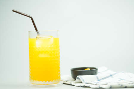 Cold drink with fresh orange juice and fresh slice peachの写真素材