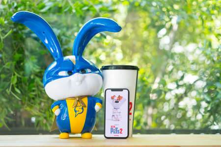 Bangkok, Thailand - June 2, 2019 : The Secret Life of Pets 2 movie logo on the mobile phone and model toy is an American 3D comedy film produced by Illumination Entertainment.のeditorial素材