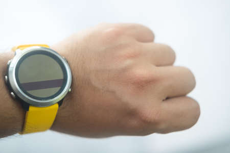 Modern smart watch with empty screen in man wristの写真素材