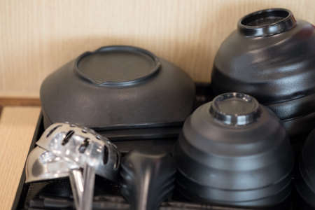 Black bowl inner side and black outside. They are arranged neatly for ease of use in restaurant for Shabu and sukiyaki or hot potの写真素材