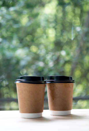 Two brown craft paper coffee cup. Ready to go or take away coffee.