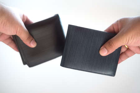 Men leather wallet in hand on white background. Elegance expensive fashion purse.
