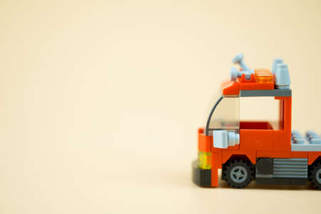 Red toy firefighter car, concept of public benefit