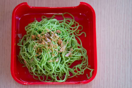 Close up of jade noodle on red tray