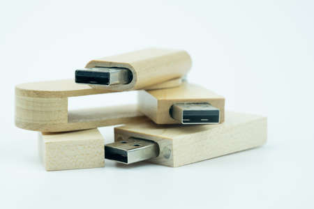 Group of wooden USB flash drive on white background. USB port plug-in computer laptop for transfer...