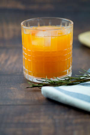 Fresh orange juice with ice in a glassの写真素材