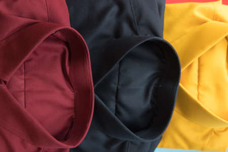 Stack of colored men shirt, background shirt  (red,black and yellow)の写真素材