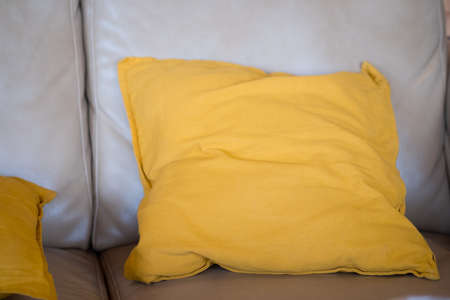 Yellow pillow decoration on sofa in living room