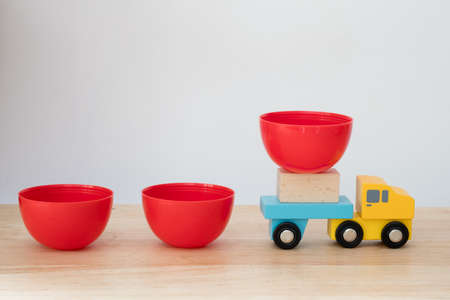 Toy wooden truck carry egg surprise after open. Concept of surprise toy for funの写真素材