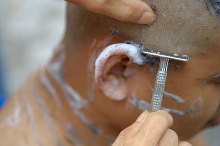 The ceremony of shaving the hair, Buddhist Ordinationの写真素材