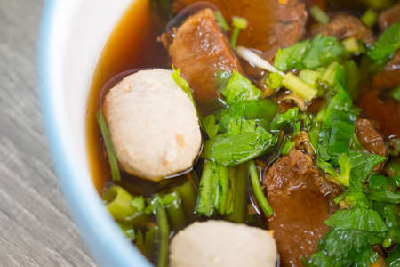 Thai style cuisine. Stew beef soup, close up