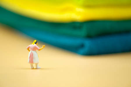 Miniature people : Housewives in hard to work in house. Concept of wifeの写真素材