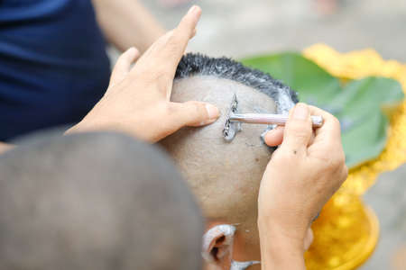Closeup shot of Shaved hair for ordained Buddhist man. Ordain into monkhood, Thailandの写真素材
