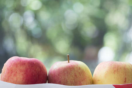 Group of red apples with nature background