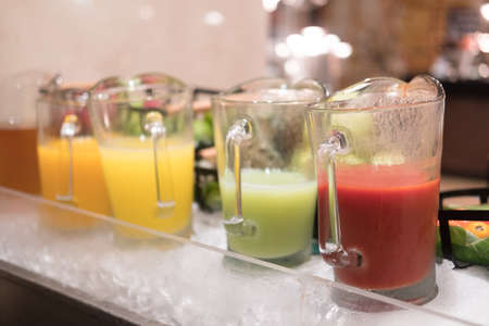 Fresh juice in jar put on counter bar buffet at hotel, healthy drinkの写真素材