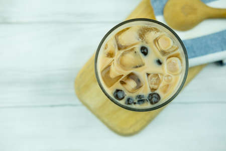 Bubble milk tea with tapioca pearl ball in drinking glass, top viewの写真素材