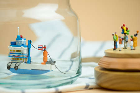 Miniature people: Passenger waiting generic Thai fishing ship or tourist ship modified from fishing...