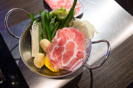 Shabu shabu meat and vegetable served in panの写真素材