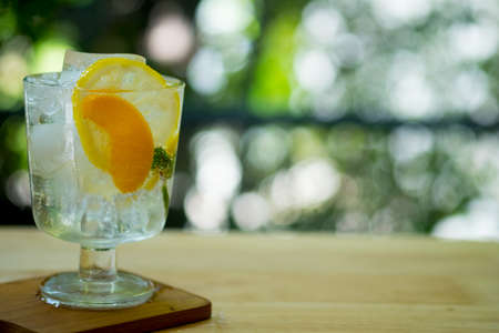 Cocktail refreshing drink beverage in a glass on a table for summer days. Holidays party concept.の写真素材