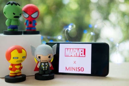 Bangkok, Thailand - August 12, 2019 : Souvenir in Miniso shop, figure of Avengers on wood table sell in Thailandのeditorial素材