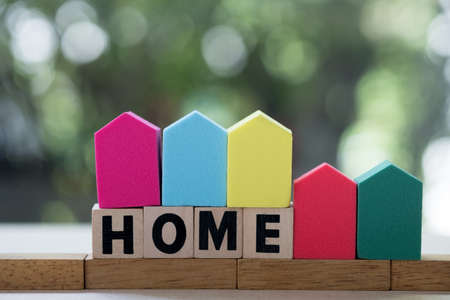 Wooden block word with HOME. The concept of buying and selling real estate, rental housing, Home protection, Home protectionの写真素材