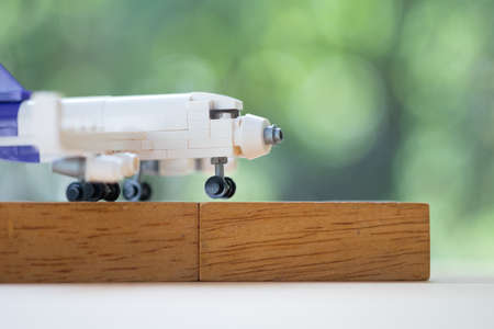 Toy plane model put on wooden blocks. Logistics and transportation management ideas and Industry business commercial concept.の写真素材