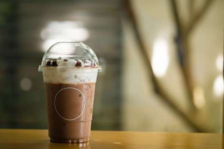Mocha iced coffee with empty circle label on a glass at coffee shop