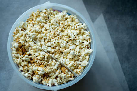 Two flavour popcorn sweet and salty in big bucket. Top view