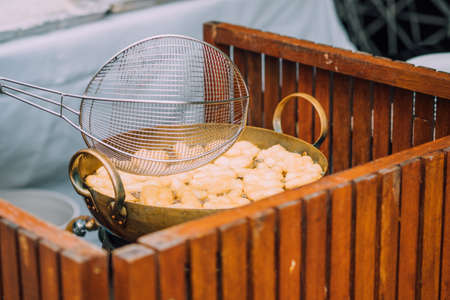 Patongko - Frying deep fried dough stick in pan sell in morning market of Thailand.の写真素材