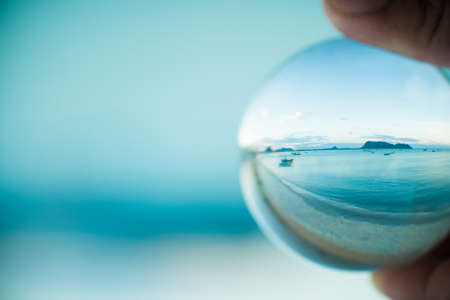 Panoramic view of the beach in prachuap khiri khan Thailand through the glass ball