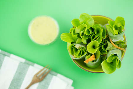 Salad rolls with salad dressing. Fresh spring rolls in fusion food style