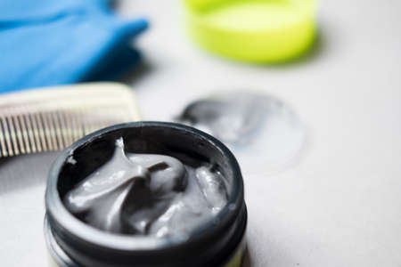 Black hair wax and clay in tubs for men