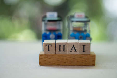 Word letters alphabet of Thai with public service car backgroundの写真素材