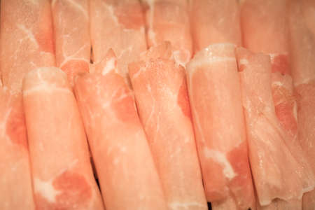 Slices of pork for cooking in hot pot for sukiyaki or hot pot set. Taiwan sukiyaki