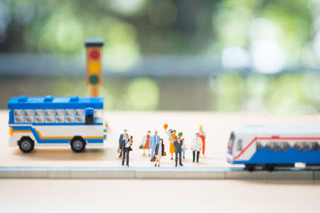 Miniature people: Traffic within the capital between people and public bus or train. Image use for business concept.の写真素材