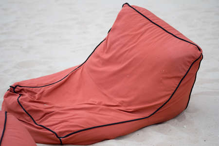 Soft orange bean bag seats to relax on the beach. Relax concept.の写真素材