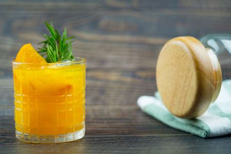Freshly squeezed orange juice with slice orange fruit and ice cubesの写真素材