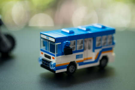 Miniature toy bus. People travel by bus in Bangkok. Buses are one of the most important public transport system in Bangkok.の写真素材