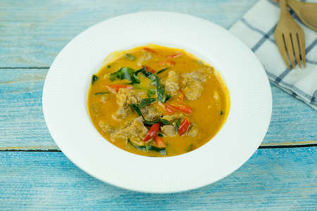 Thai curry red soup. Thailand traditional red curry with pork or chicken menu in Thai name is panang.Curry menu with coconut milk.の写真素材