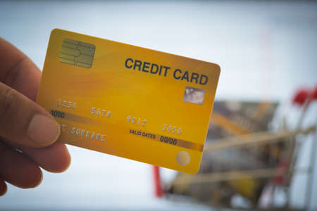 Close up man man holding mock up credit card.Online shopping concept.