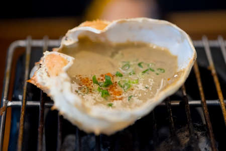 Zuwai Kani miso korasho is grilled crab fat on stove, Japan seafood