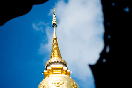 Chedi or pagoda in Wat Phra That Hariphunchai, a Buddhist temple in Lamphun, Thailand, which believed to house a hair of Buddha and now a tourist destinationの写真素材