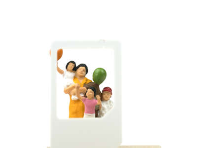 Miniature people. Businessman talk family with technology smartphone. Concept of communicating online. Stay in touch despite long distance,の写真素材
