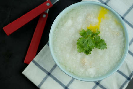 Congee with minced pork. Breakfast food concept.